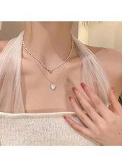 Huitich layered pearl pendant necklace with delicate chains and heart-shaped pendant on model