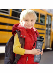 Huitich leakproof gym water bottle with strap held by smiling child near school bus