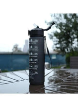 Leakproof water bottle with strap, flip-top lid, water splash
