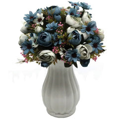Light blue artificial flower bouquet of peony flowers and greenery in white vase