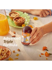 EVA PHARMA Omega 3 Fish Oil with Vitamin D3 bottle beside nuts and juice on a dining table