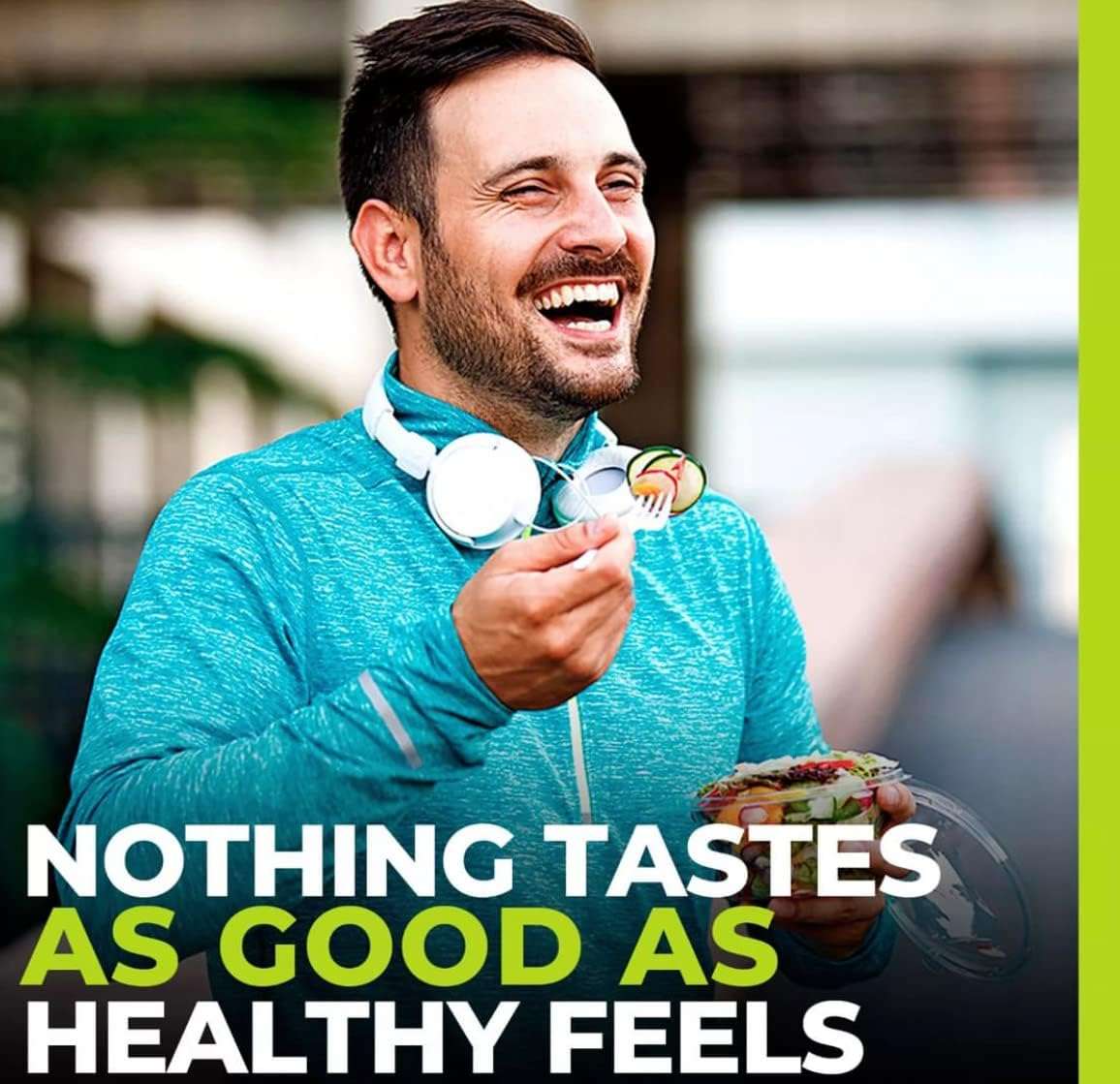Smiling man in teal jacket eating a salad with headphones around his neck promoting monk fruit sweetener UAE for healthy living