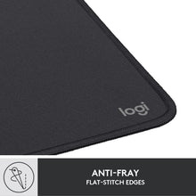 Black mouse pad corner with stitched edge and logi logo, textured fabric top