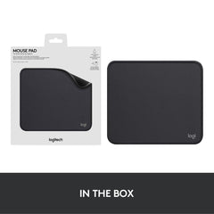 Logitech black anti-slip computer mouse mat with smooth surface and rounded edges in packaging and out