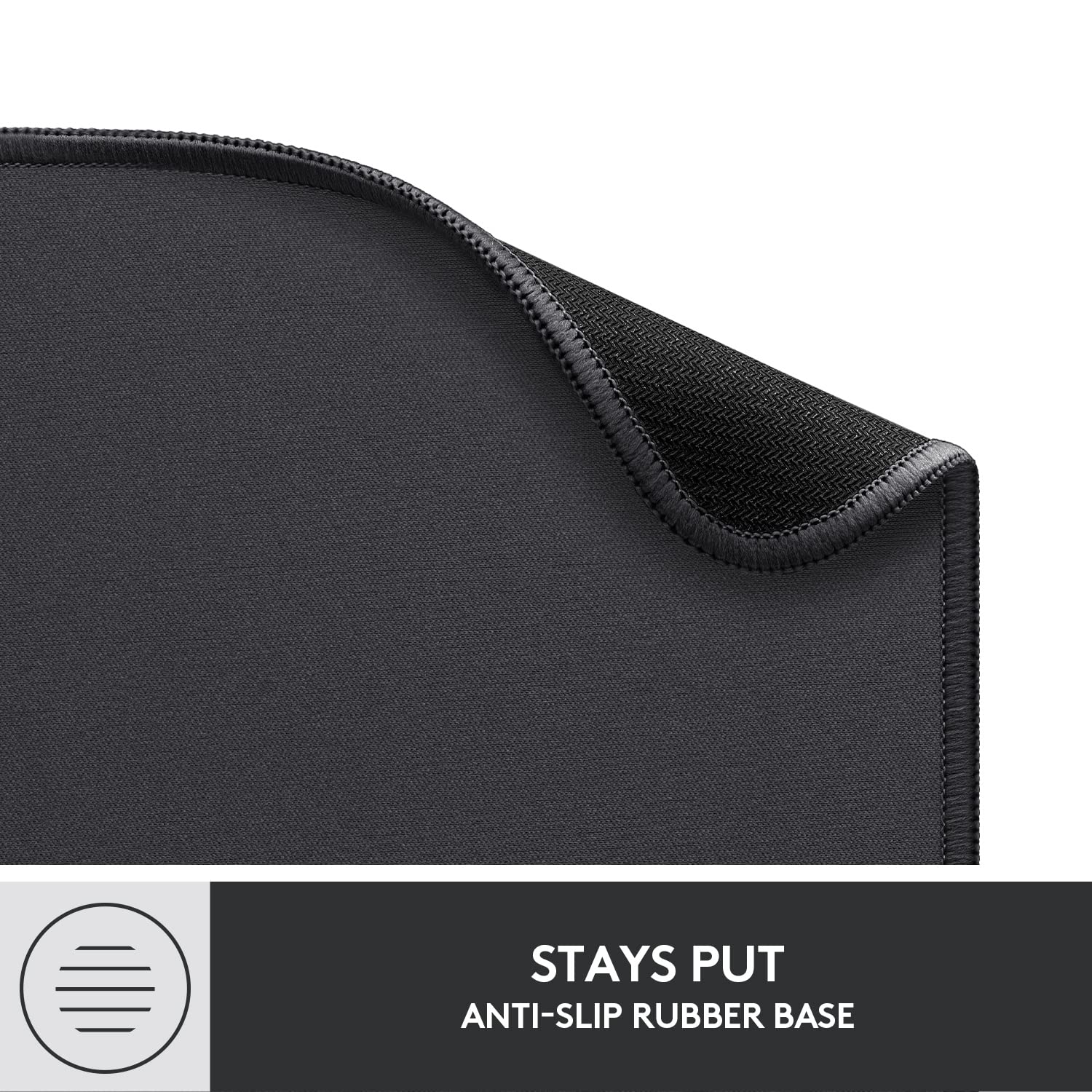Logitech black anti-slip computer mouse mat with stitched edges and rubber base for stability