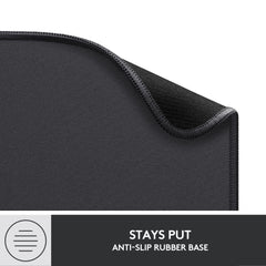 Logitech black anti-slip computer mouse mat with stitched edges and rubber base for stability