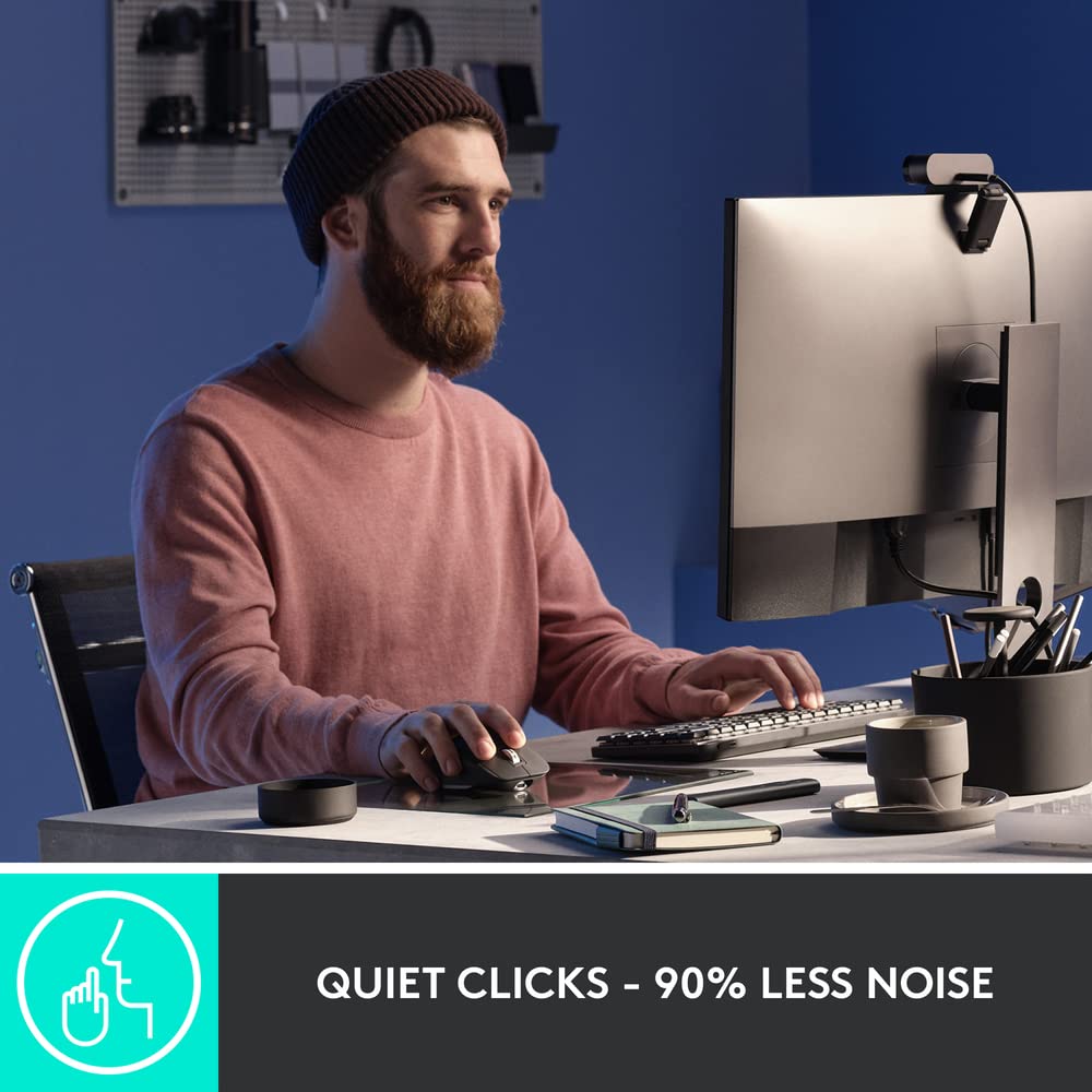 Logitech ergonomic mouse for productivity with quiet clicks used by man working at computer desk