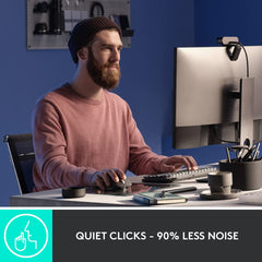 Logitech ergonomic mouse for productivity with quiet clicks used by man working at computer desk