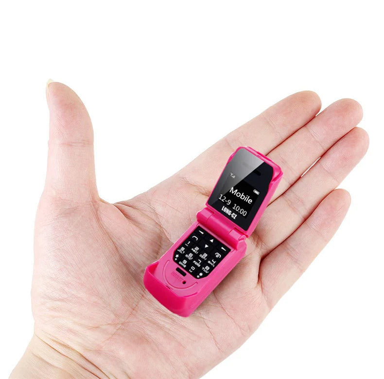 Mumzar pink mini flip phone bluetooth shown open in hand compact mobile with numeric keypad and small display