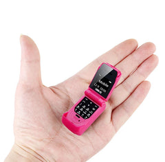 Mumzar pink mini flip phone bluetooth shown open in hand compact mobile with numeric keypad and small display