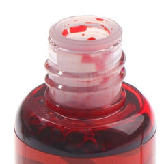 Huitich long lasting vegan lip color stain in a clear bottle with red tint inside