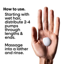 Shampoo application: hand holding white lather with bottle