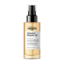 L’Oreal Professionnel Absolut Repair oil bottle with black pump cap, amber label.