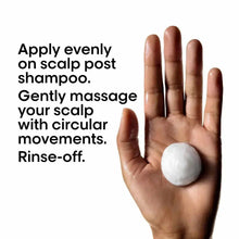 Scalp treatment application: white foam on palm with circular massage