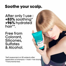 Teal scalp treatment tube with black cap held in hand, Scalp Advanced