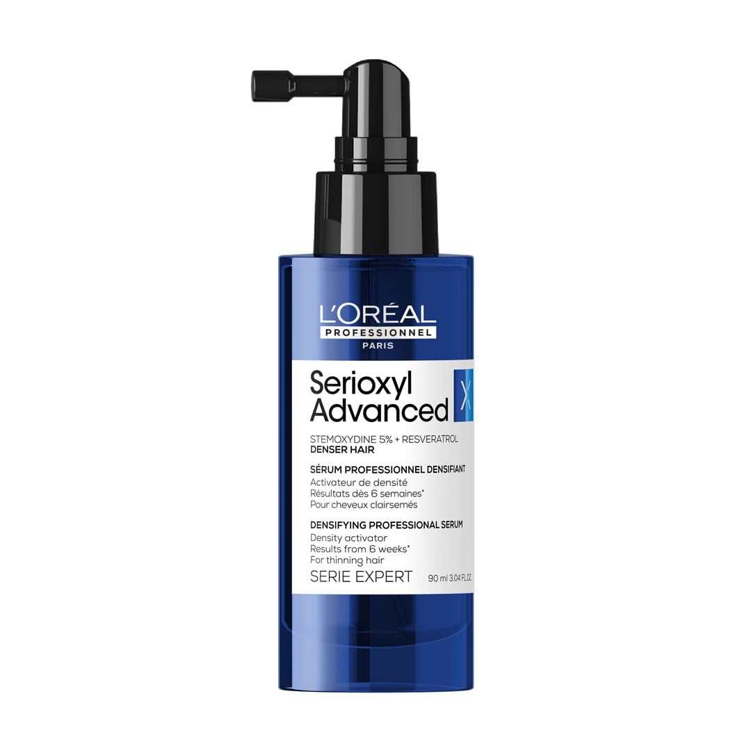 L’Oréal Serioxyl Advanced Serum for hair growth in a blue pump bottle for thicker hair