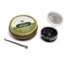 Lotus Blooming Herbs tin and open jar showing pure Himalayan shilajit resin with metal applicator for daily wellness