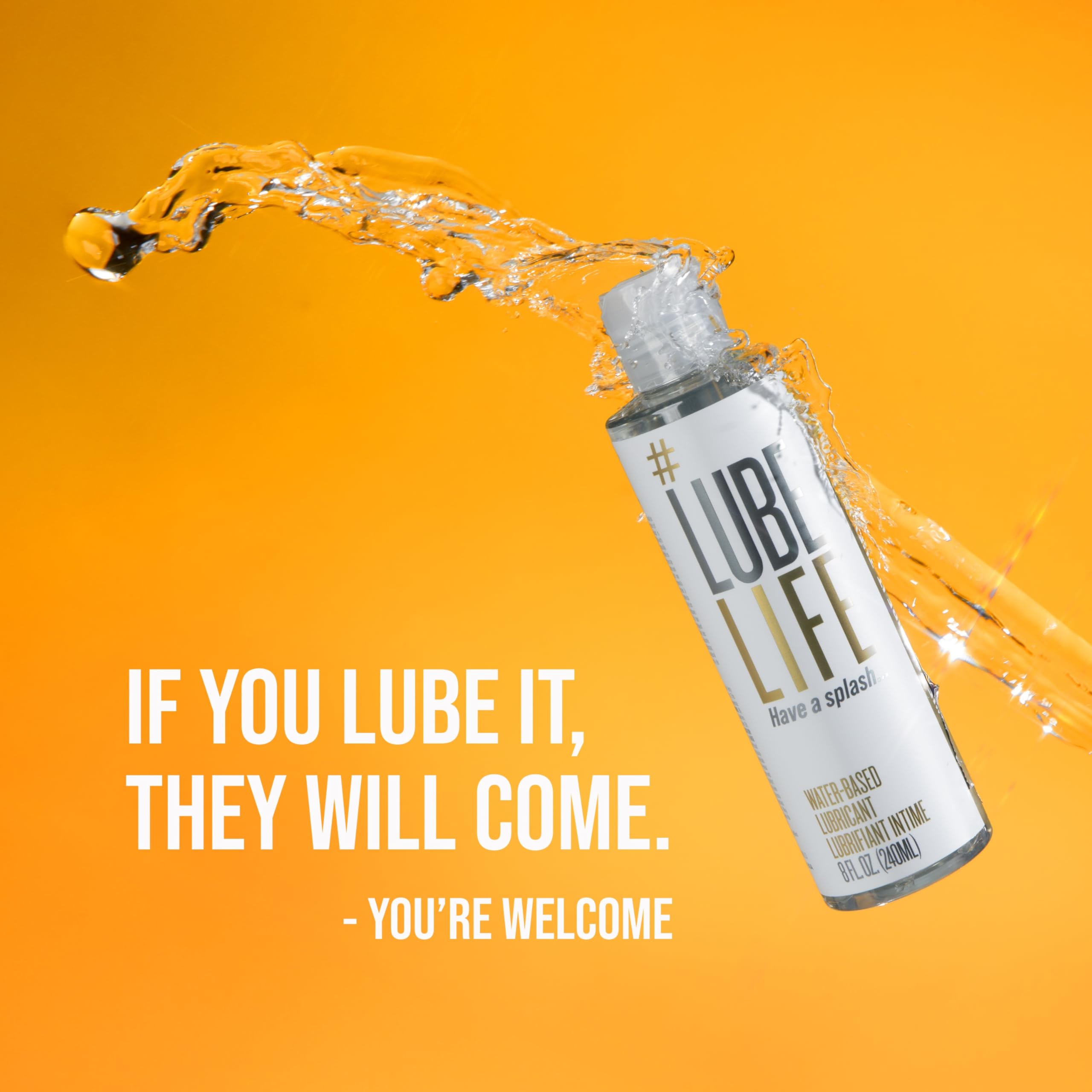 Lube Life bottle with water splash on orange background showing label and tagline water based personal lubricant