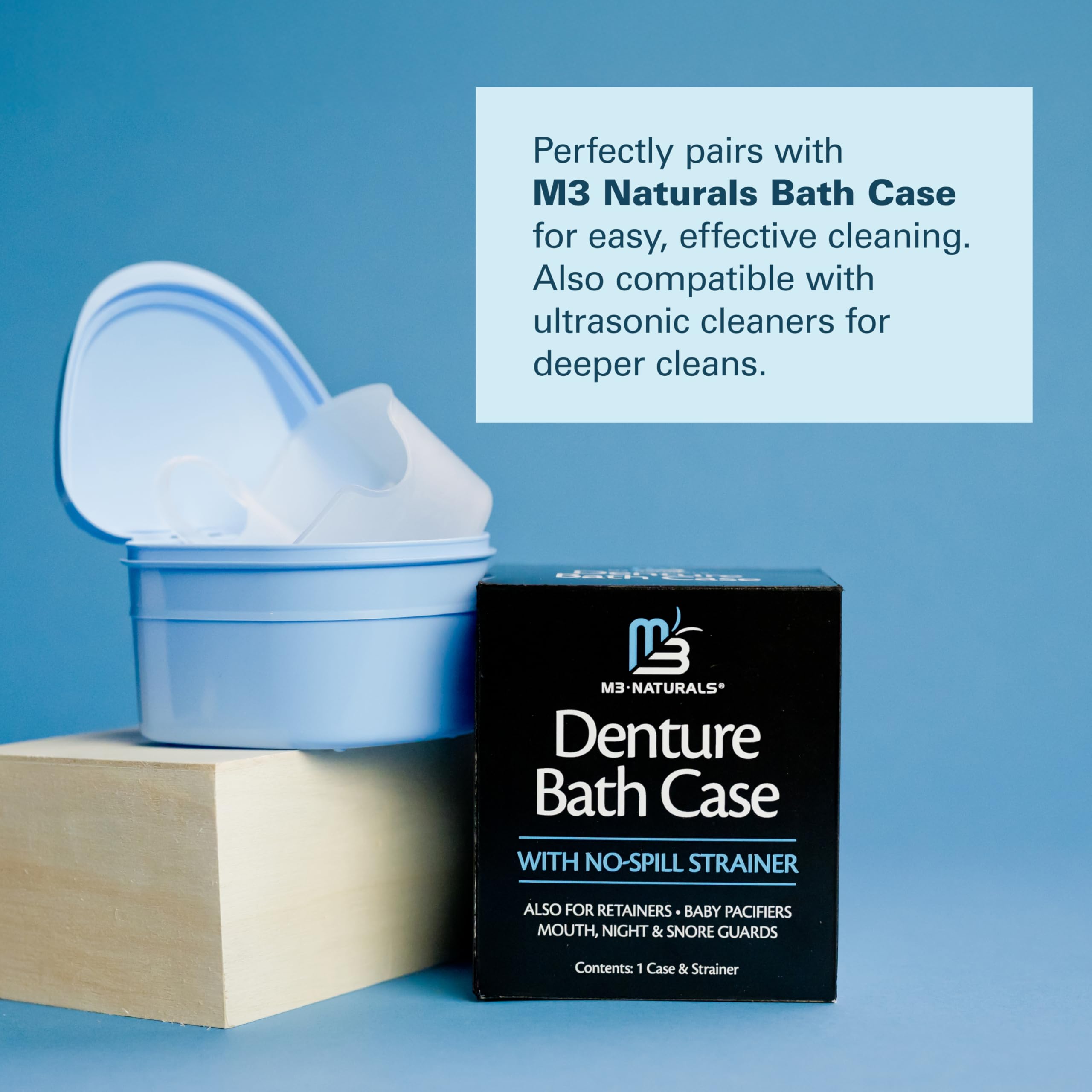 M3 Naturals open blue denture bath case with no spill strainer beside product box retainer cleaner tablets compatible