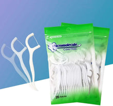 Dental floss pick set with white picks and green care floss bags