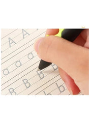 Hand writing letter B on Mumzar magic calligraphy copybook set with dotted guide lines