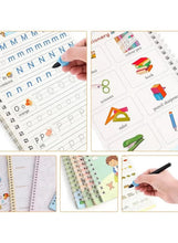 Handwriting practice copybooks with letter and number guides on open pages