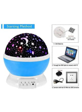 Galaxy night lamp with star dome and blue base, with battery and USB connection shown