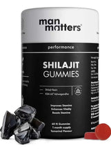 Shilajit gummies container with black resin pieces and red gummy pieces