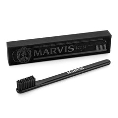 Marvis medium toothbrush in matte black with medium charcoal bristles and branded gift box