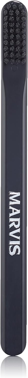 Marvis medium toothbrush in navy with MARVIS logo ergonomic handle and medium bristles for daily use