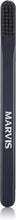 Black toothbrush handle with textured bristle end and MARVIS branding