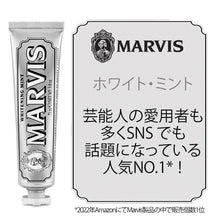 Marvis whitening mint toothpaste tube with a white product card beside it