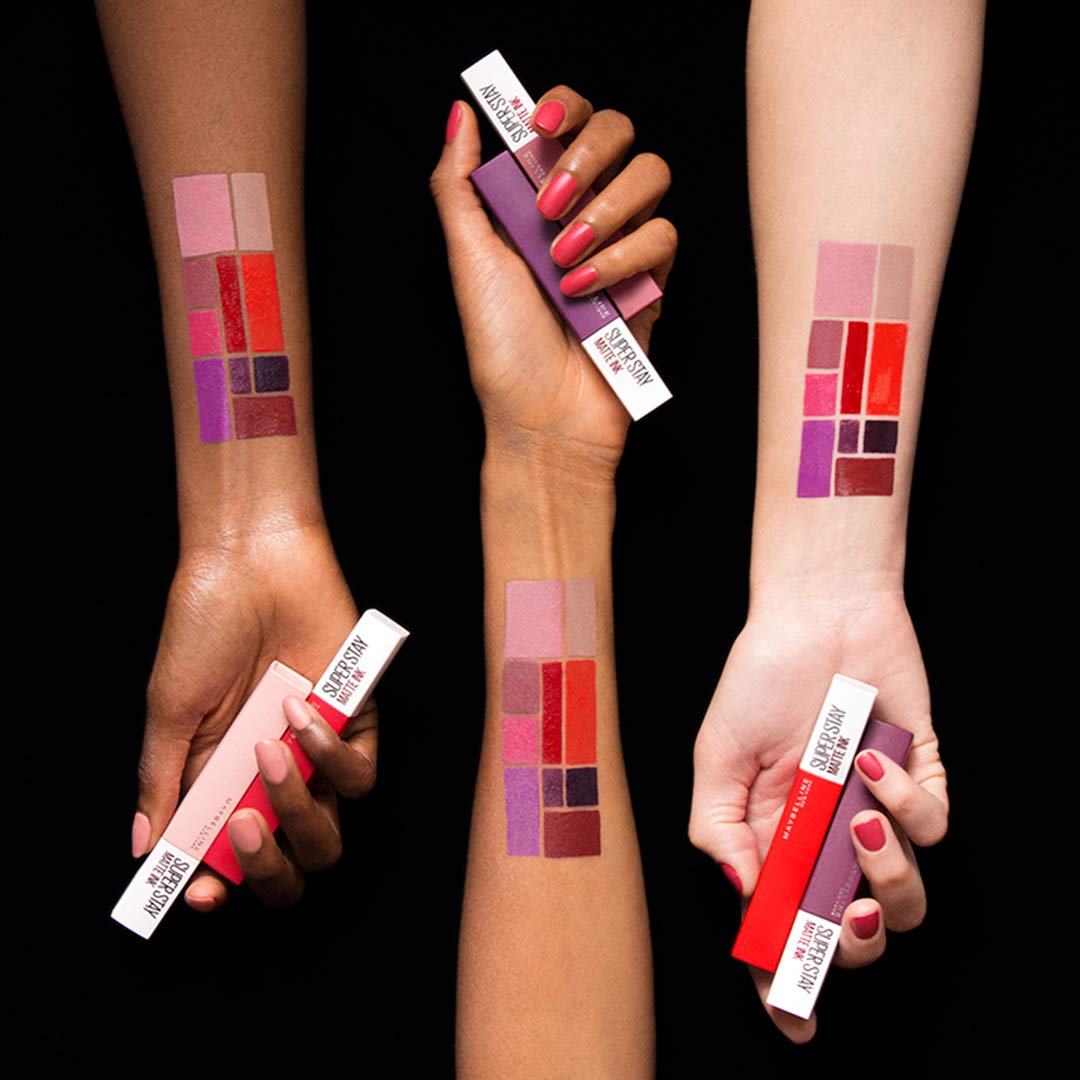 Three diverse arms showing lipstick swatches and tubes featuring Maybelline SuperStay Matte Ink lipstick shades