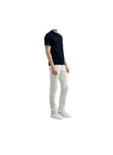 Navy blue crew-neck short-sleeve cotton T-shirt on model, side view