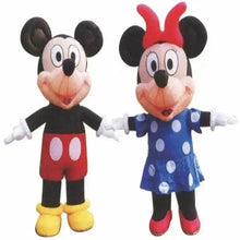 Inflatable mouse figures standing: Mickey-style red shorts and black suit; Minnie-style blue dress