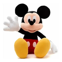 Inflatable Mickey Mouse seated with black shirt, red shorts, yellow shoes, waving arm