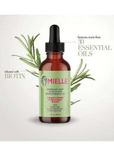 Scalp oil bottle with black dropper, green label, and rosemary mint sprig accents