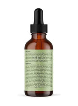 Scalp oil bottle with black dropper, brown glass, and green ingredient information panel