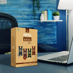EAT Anytime Mindful Assorted Nutri Bar box on desk next to laptop in office setting gluten free energy bars UAE