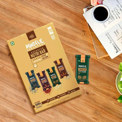 EAT Anytime Mindful Assorted NutriBar box with a green bar and coffee on wood table gluten free energy bars UAE