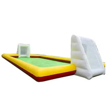 Mini inflatable football pitch with green playing field, yellow borders, white goal