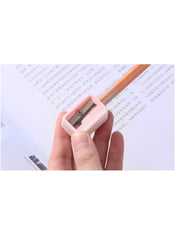 Huitich mini pencil sharpener set with pink sharpener held in hand sharpening wooden pencil