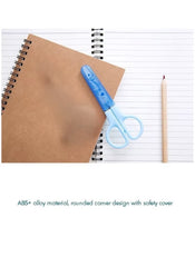 Huitich mini student safety scissors with blue rounded handles and safety cover on notebooks