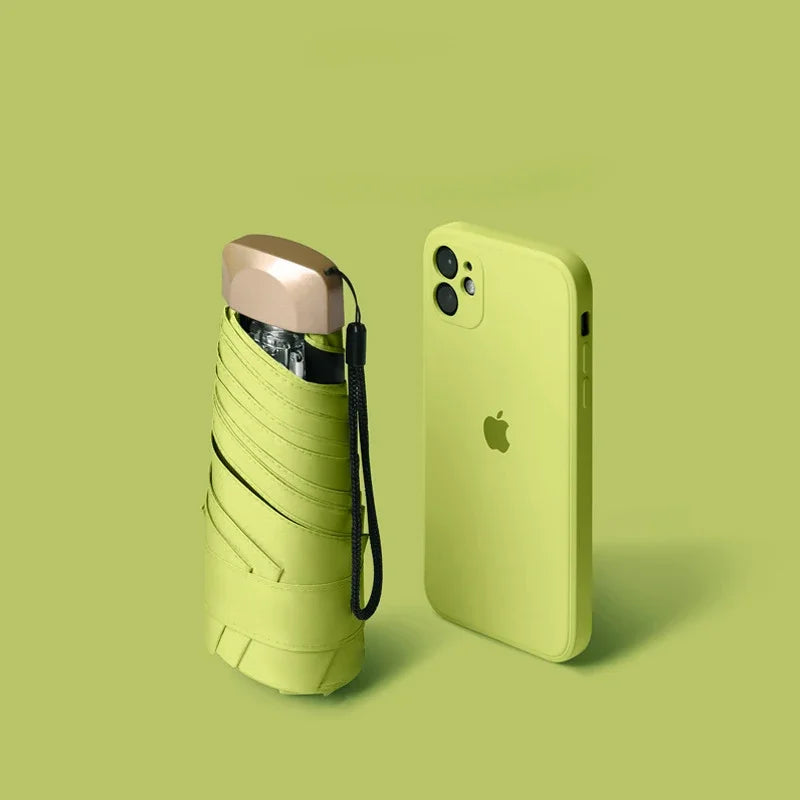 Mumzar mini sun umbrella pocket size next to an iPhone for convenient portability