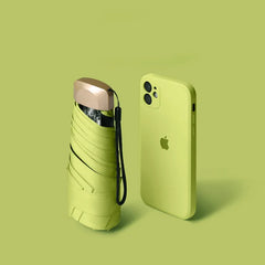 Mumzar mini sun umbrella pocket size next to an iPhone for convenient portability