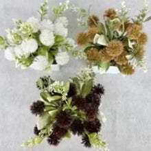 Artificial flower arrangement with white, tan, and dark blooms in staggered clusters