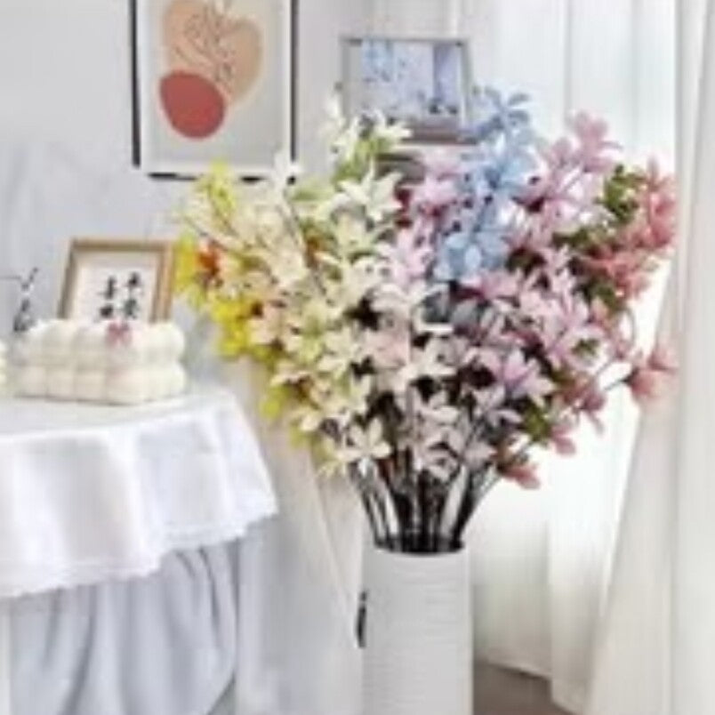 Huitich artificial orchid flowers in pastel colors arranged in a white vase for home decor