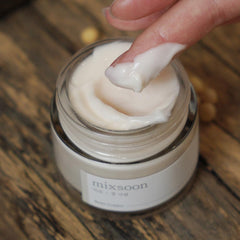 Mixsoon deep pore and sebum control moisturizer cream jar with a finger scooping product