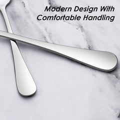 Close-up of sleek modern design stainless steel 12 piece cutlery set handles on marble background