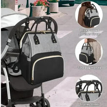 Grey and black baby travel bag with padded shoulder straps, tote handle, and stroller straps
